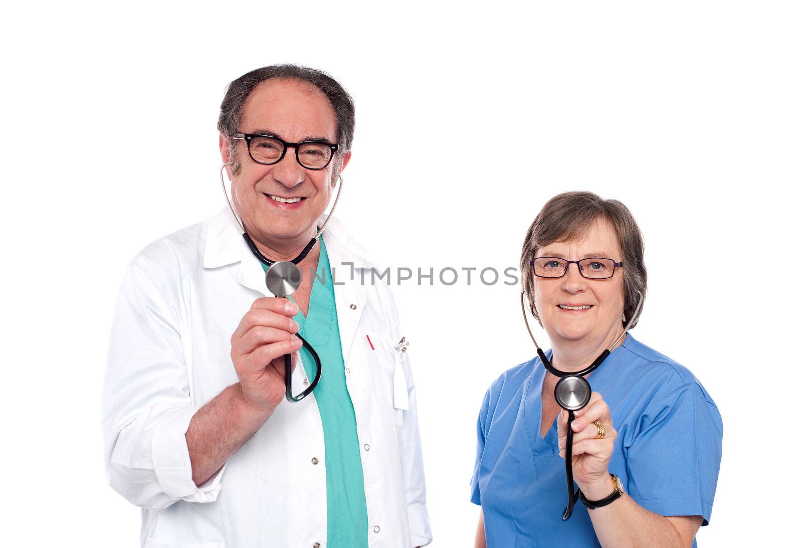 Smiling aged male and female doctors posing with stethoscope