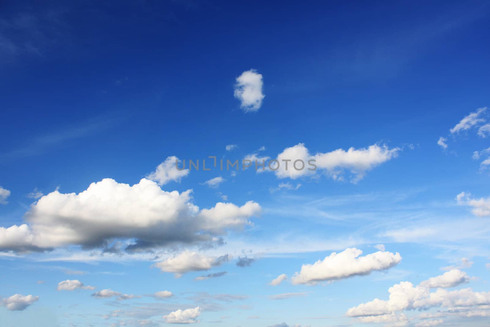 white clouds on blue sky in season