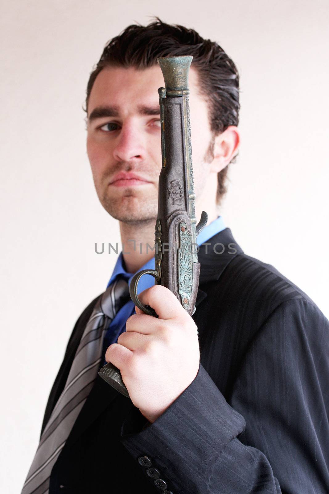 Businessman with ancient weapon by photochecker