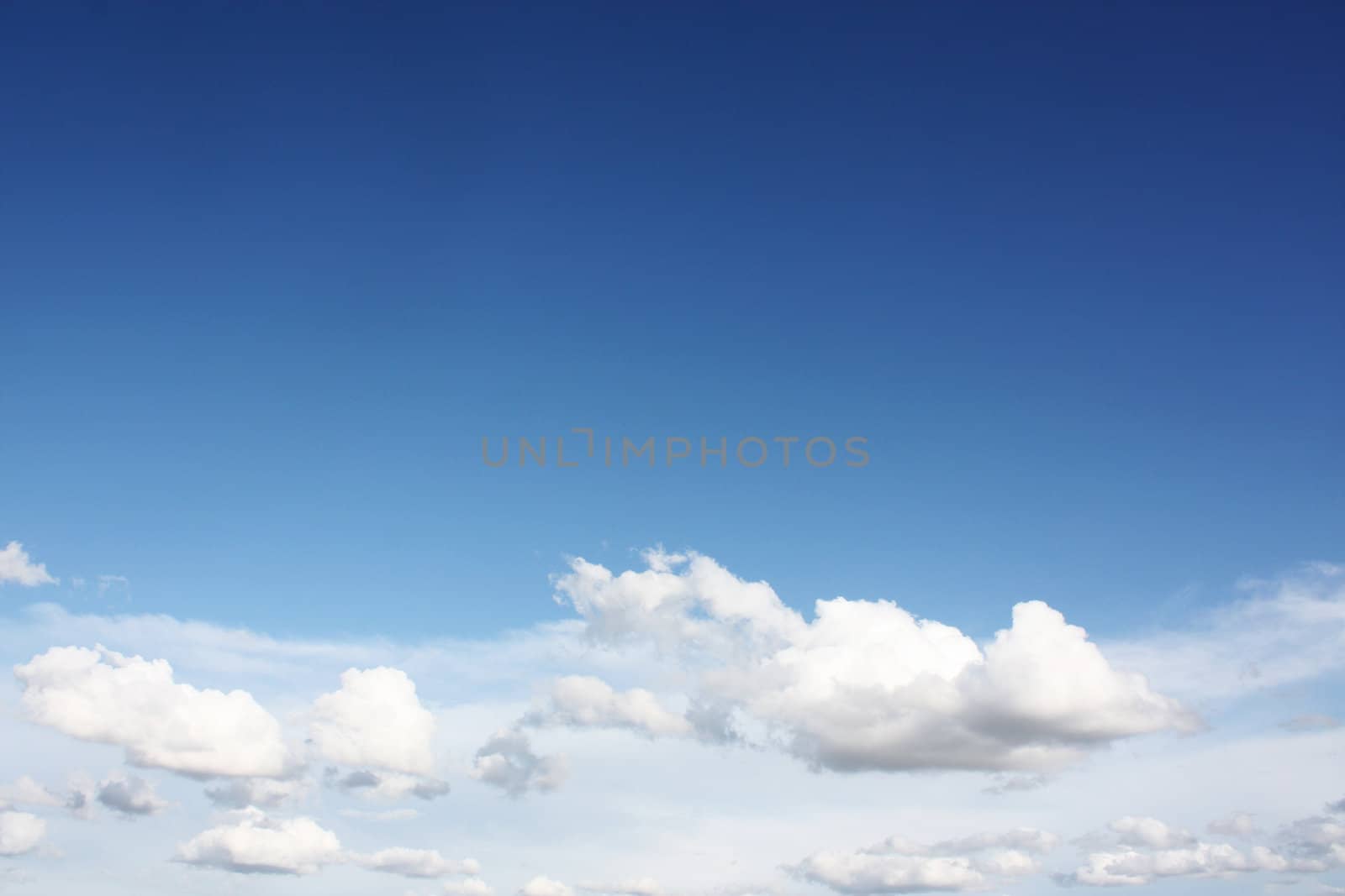 white clouds on blue sky in season