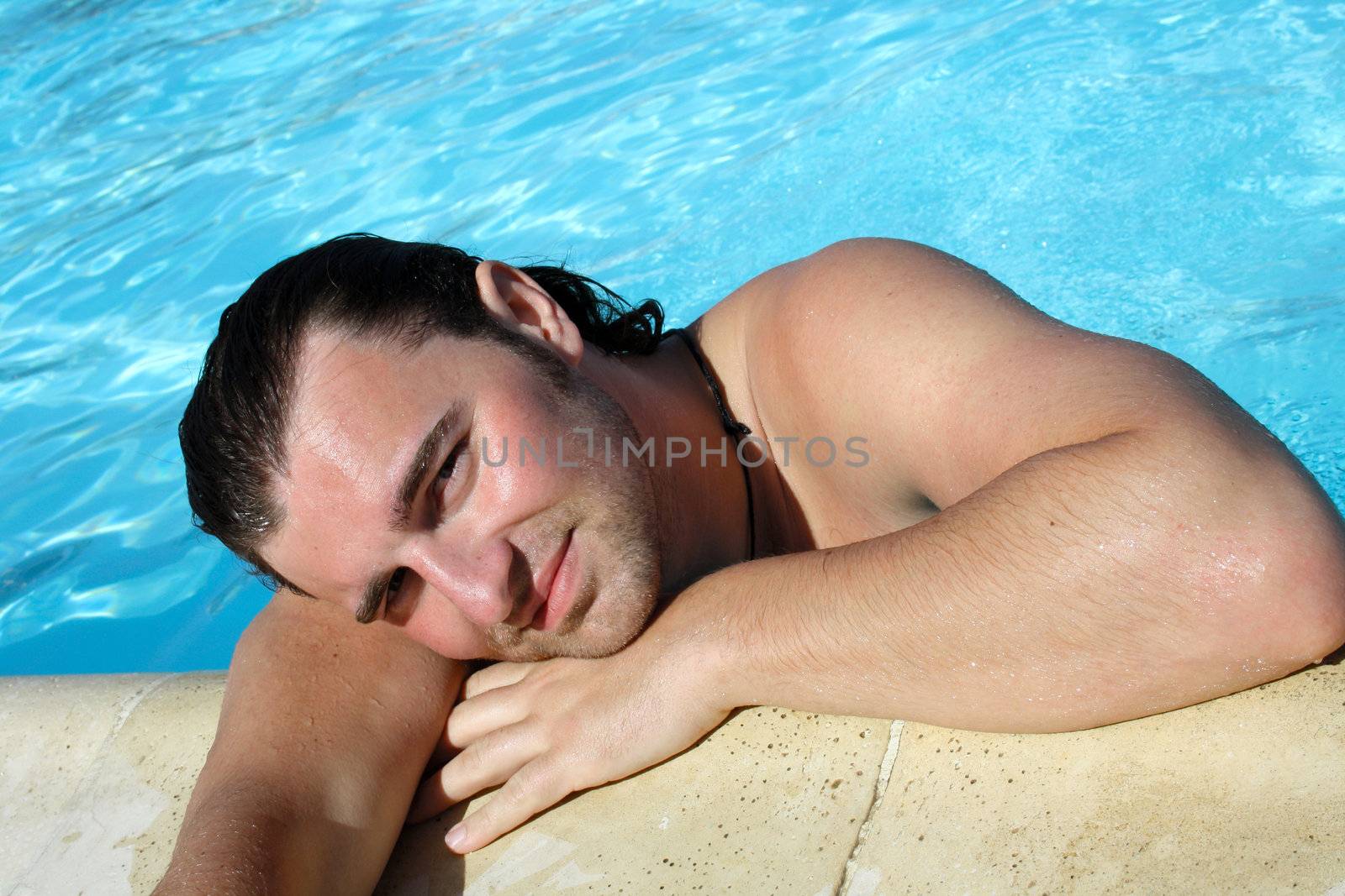 posing in the swimming pool for the photographer