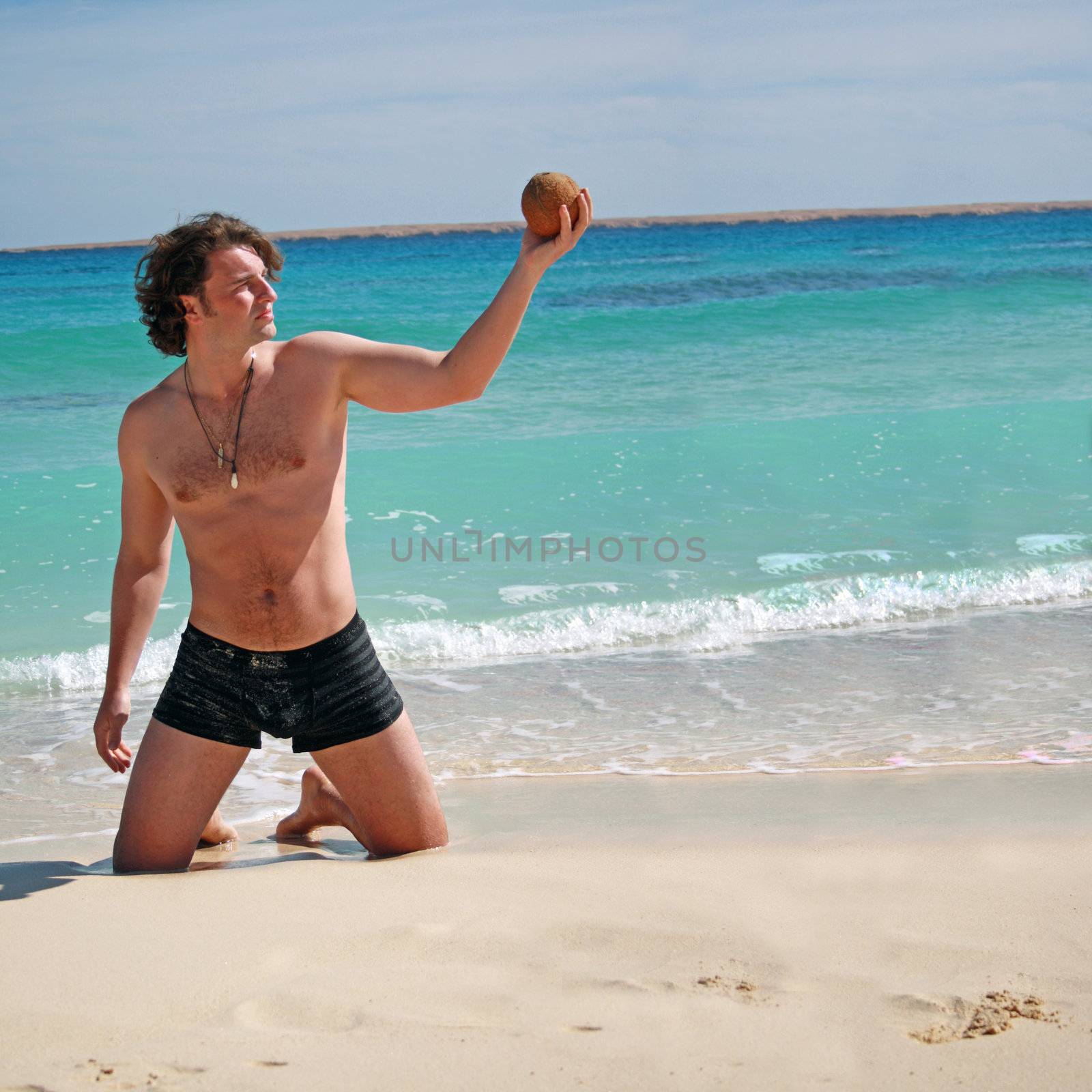 on vacation at the beach posing with coconut