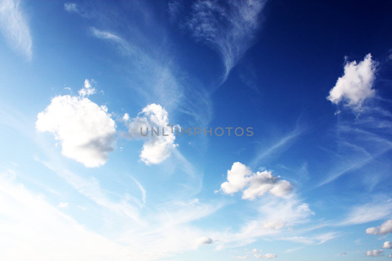 white clouds on blue sky in season