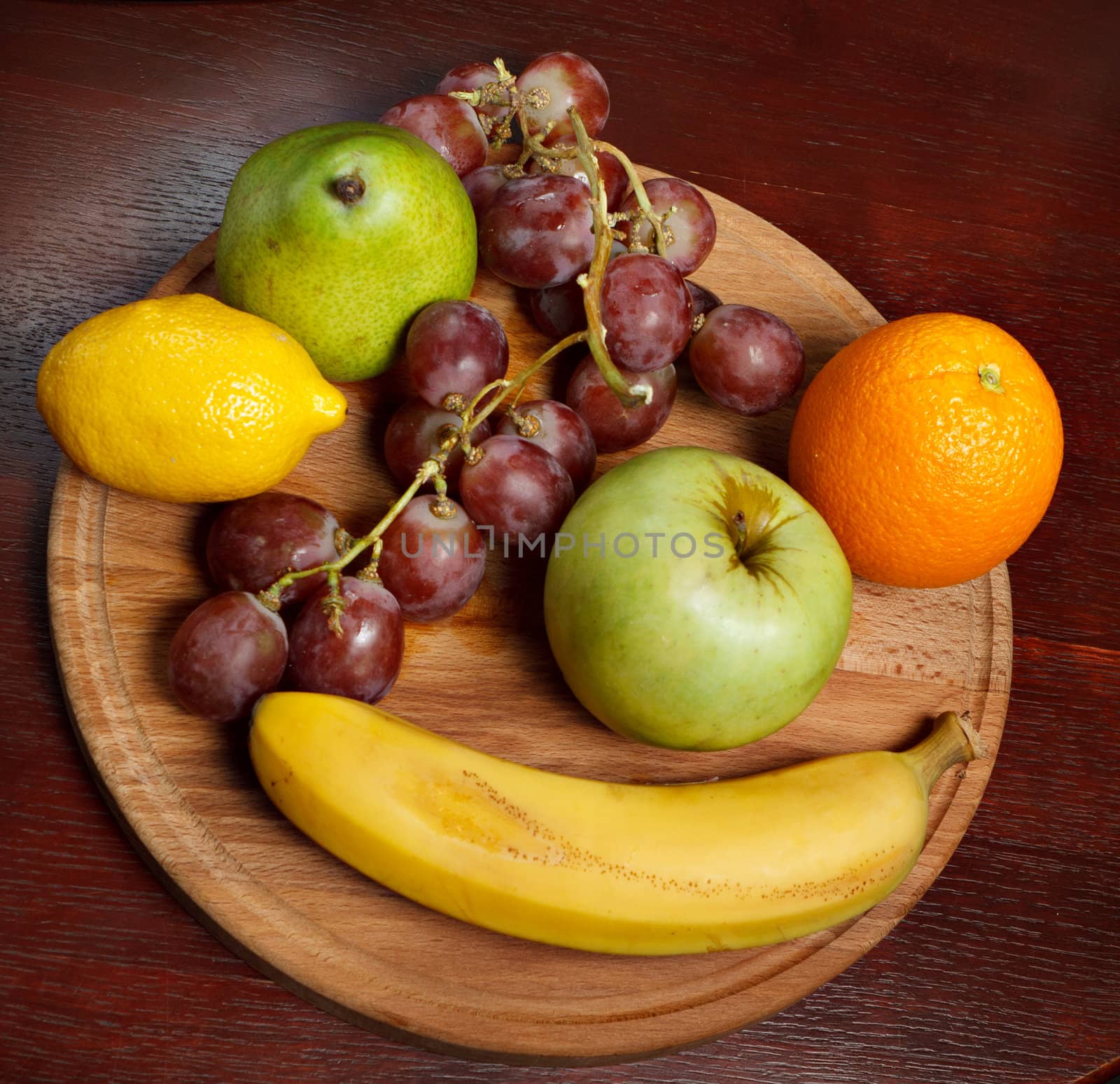 The fruit, a wooden Board on the background of a wooden table.