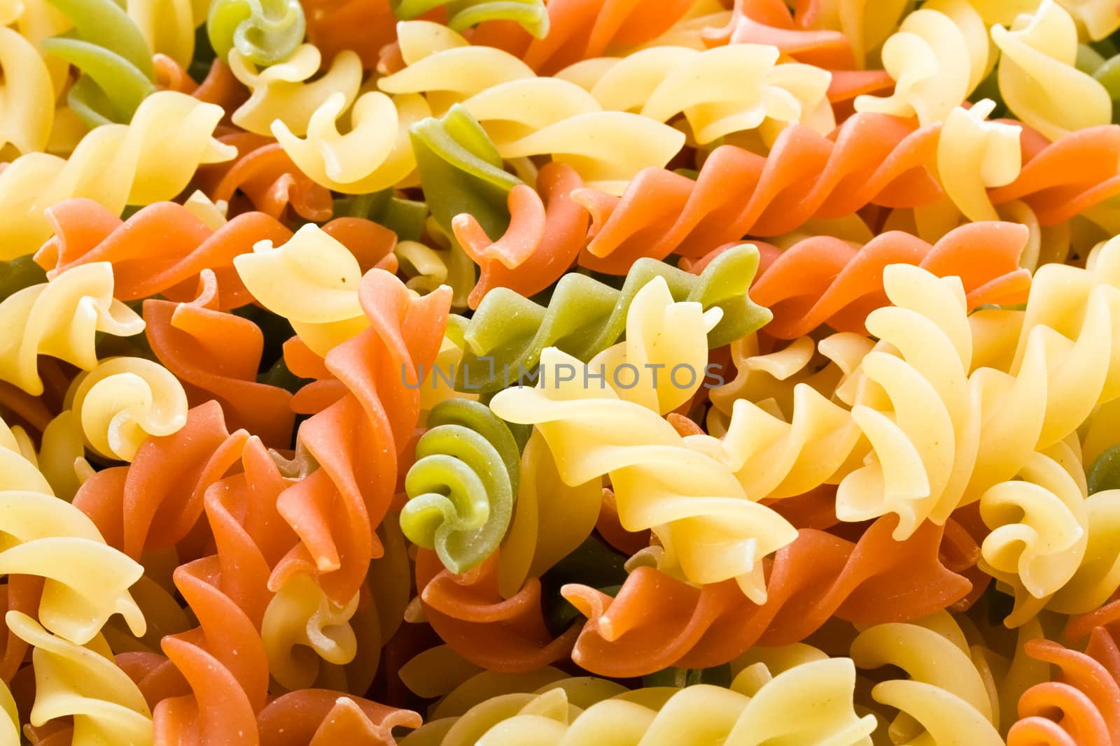 Raw italian pasta isolated on white background