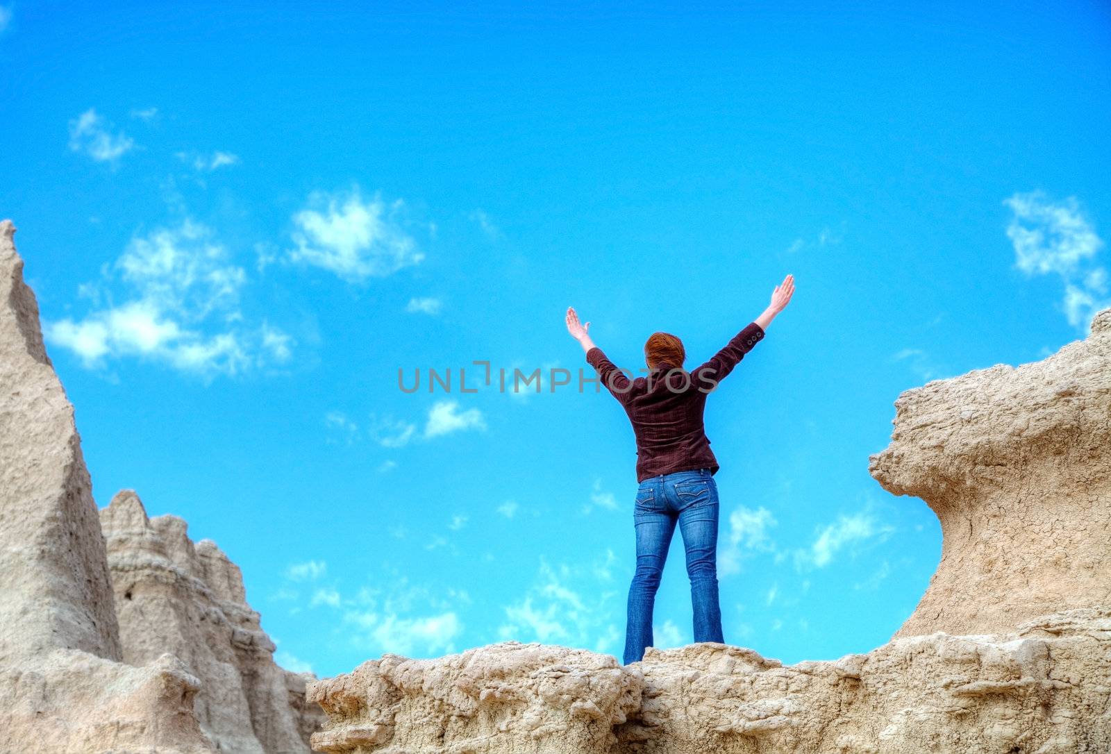 Woman with raised hands by AndreyKr