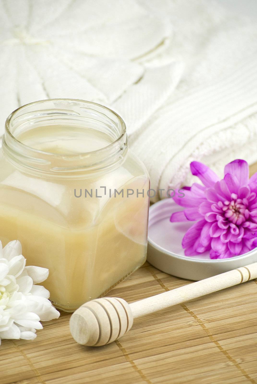 relaxing aroma of almond coconut vanilla milk and honey bath foam over wooden mat