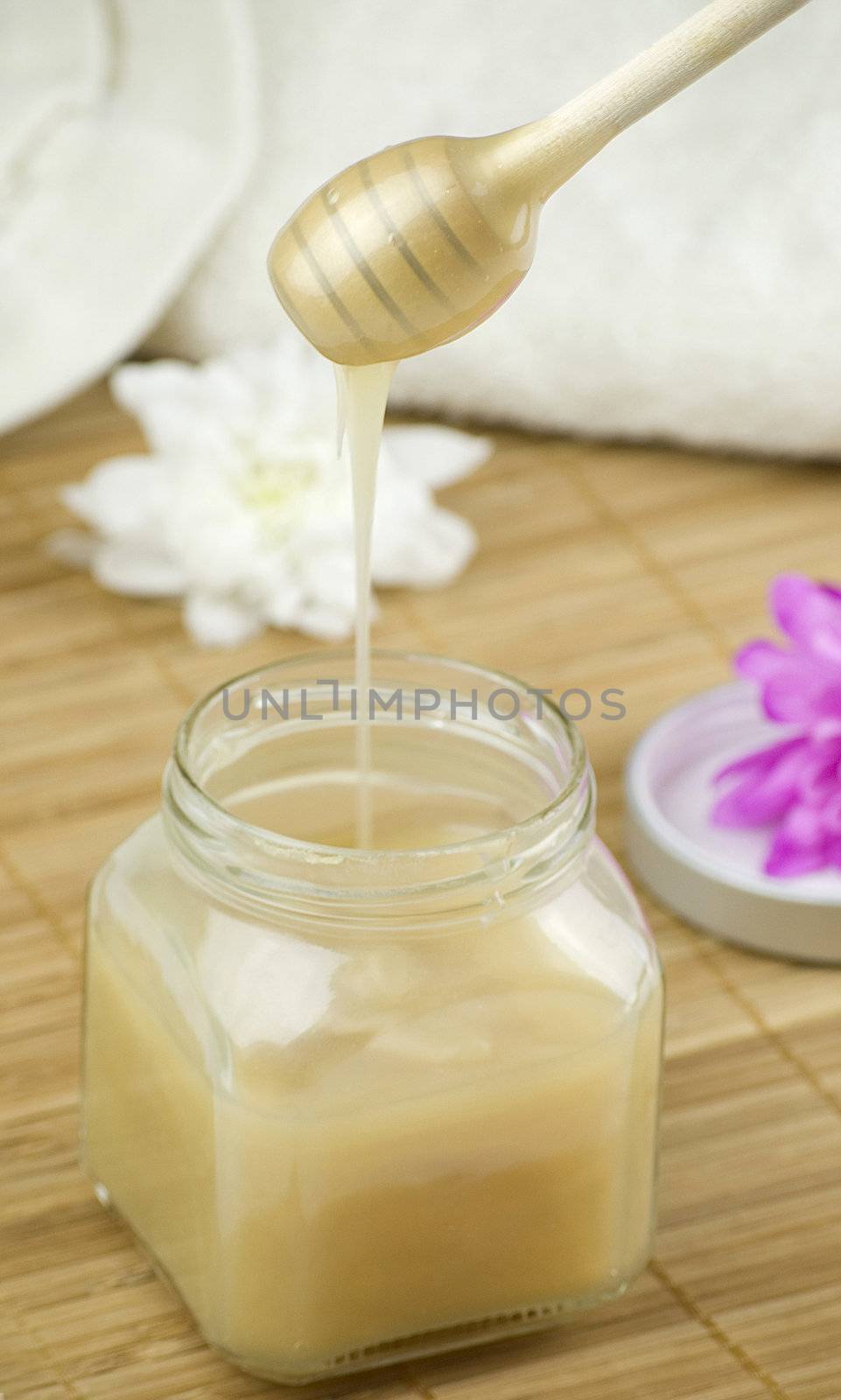 relaxing aroma of almond coconut vanilla milk and honey bath foam over wooden mat