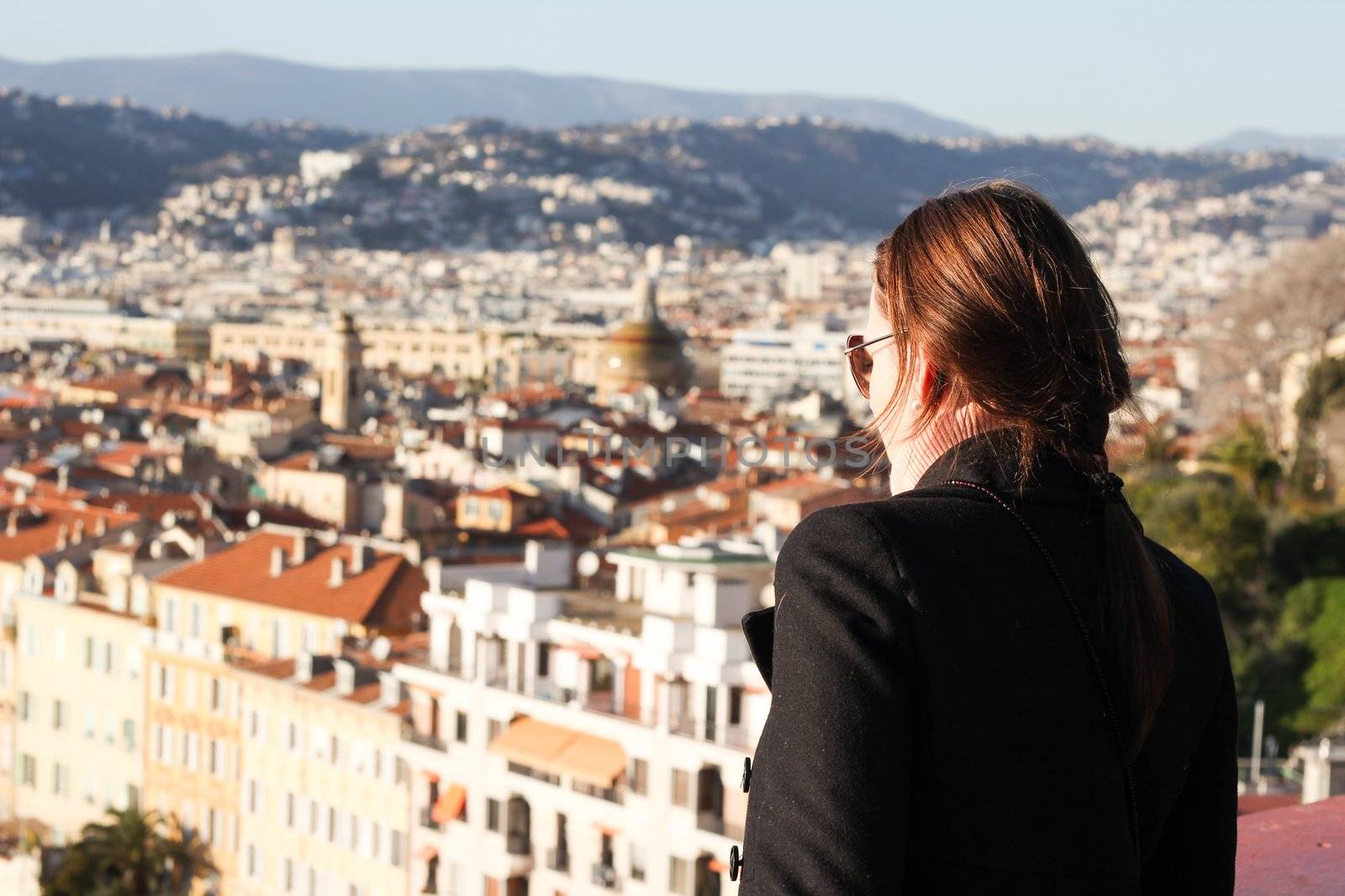 Woman looking down at the City of Nice in South of France