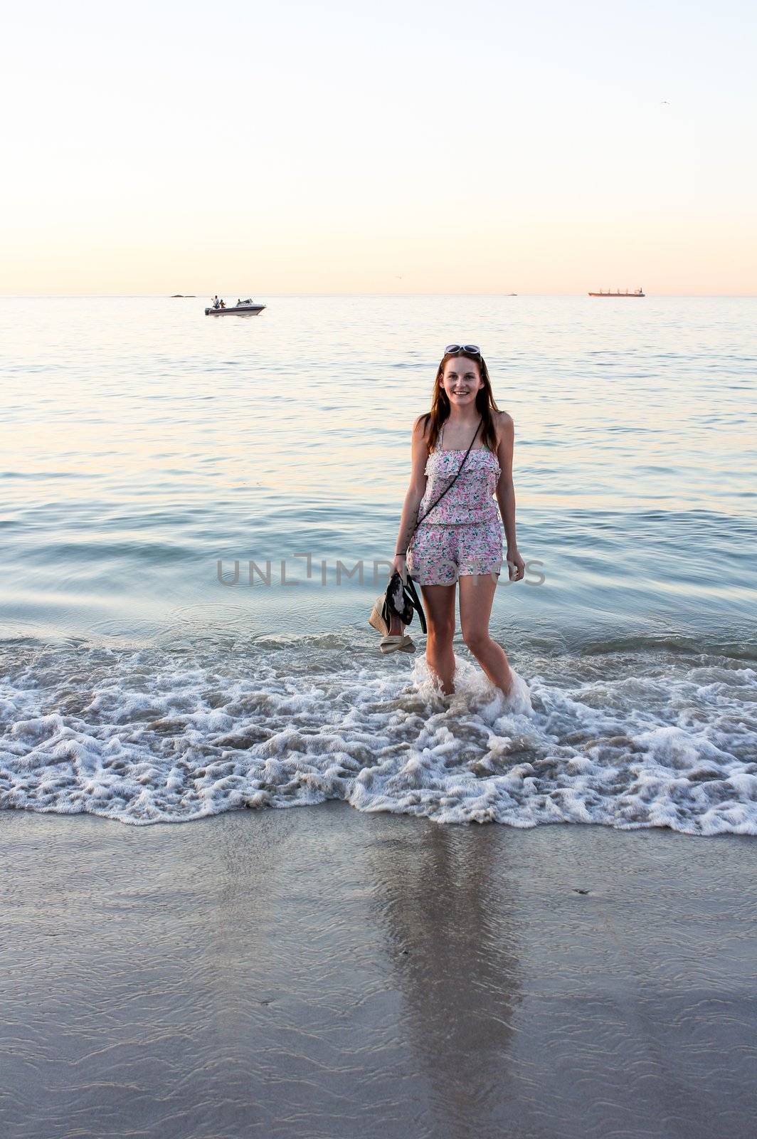 Woman smiling while standing in the sea
