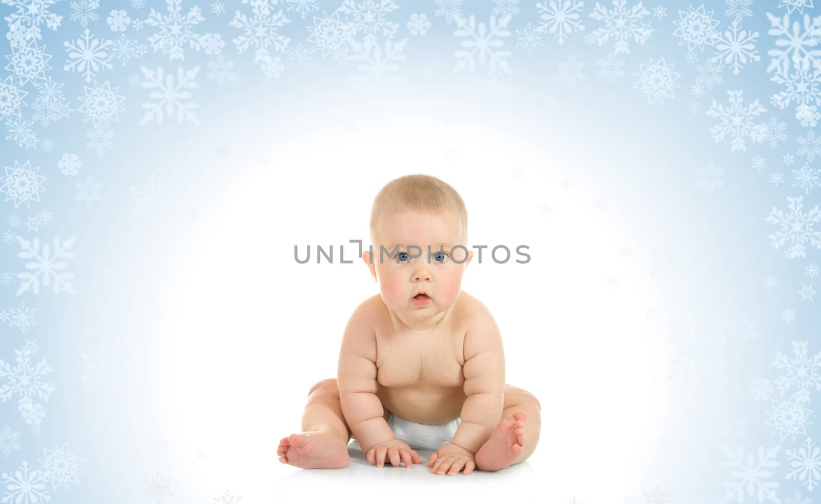 Sitting small baby on blue background with snowflakes