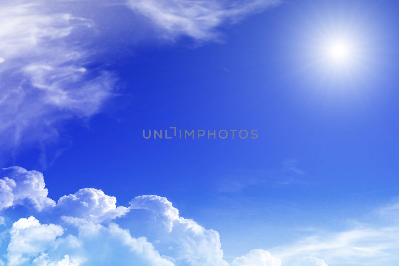 Blue sky with clouds and sun