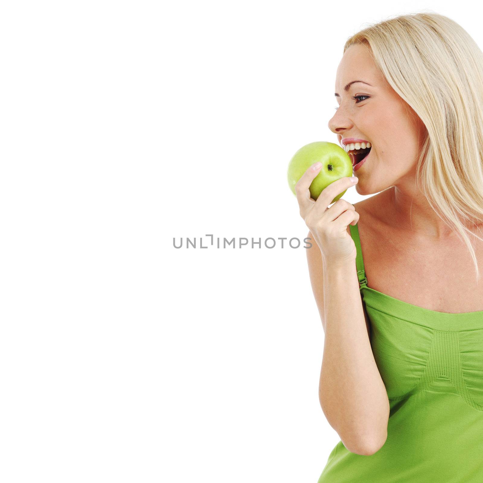 blond woman eat green apple on white