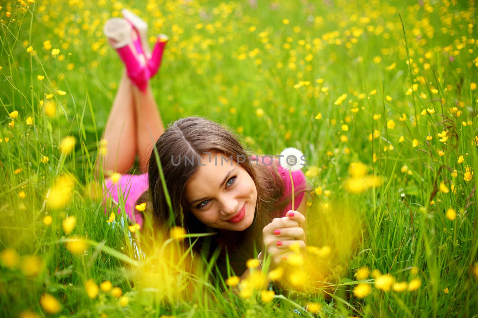 summer woman blow on dandelion 