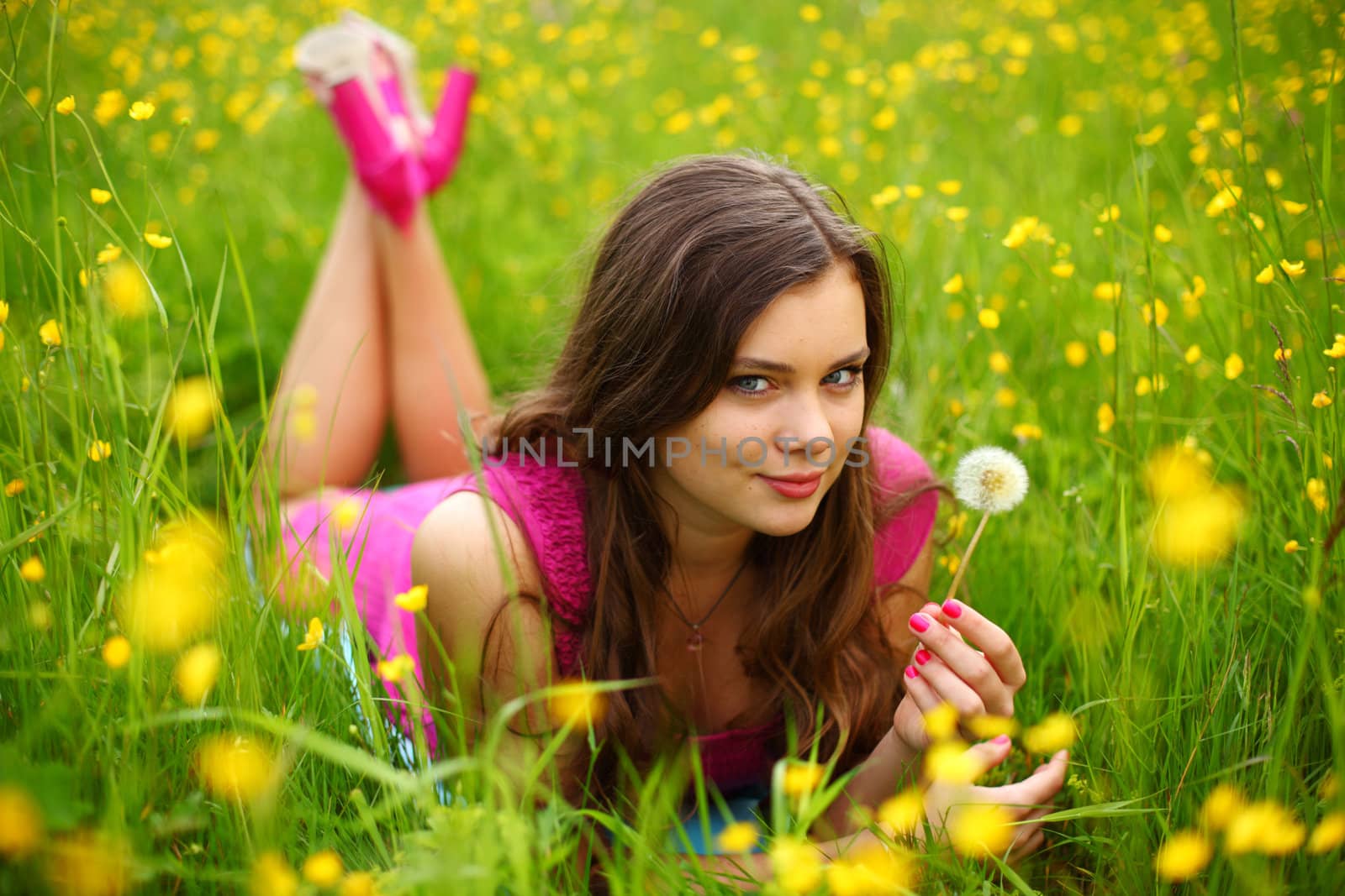 summer woman blow on dandelion 