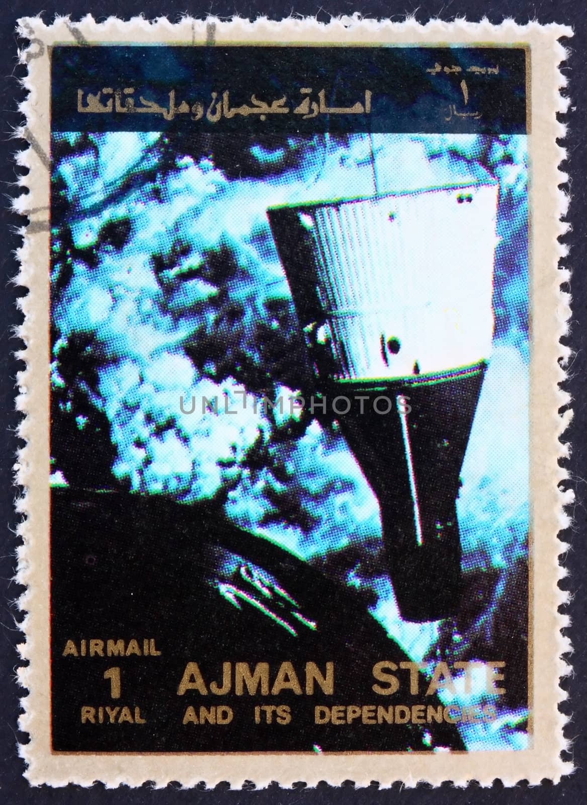 AJMAN - CIRCA 1973: a stamp printed in the Ajman shows Rendezvous of Gemini 6 and 7, Space Exploration Program, circa 1973