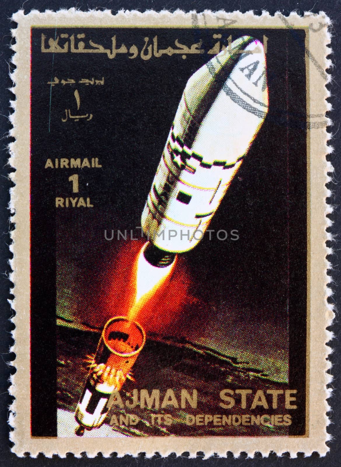 AJMAN - CIRCA 1973: a stamp printed in the Ajman shows Rocket in Space, Spaceflight Program, circa 1973