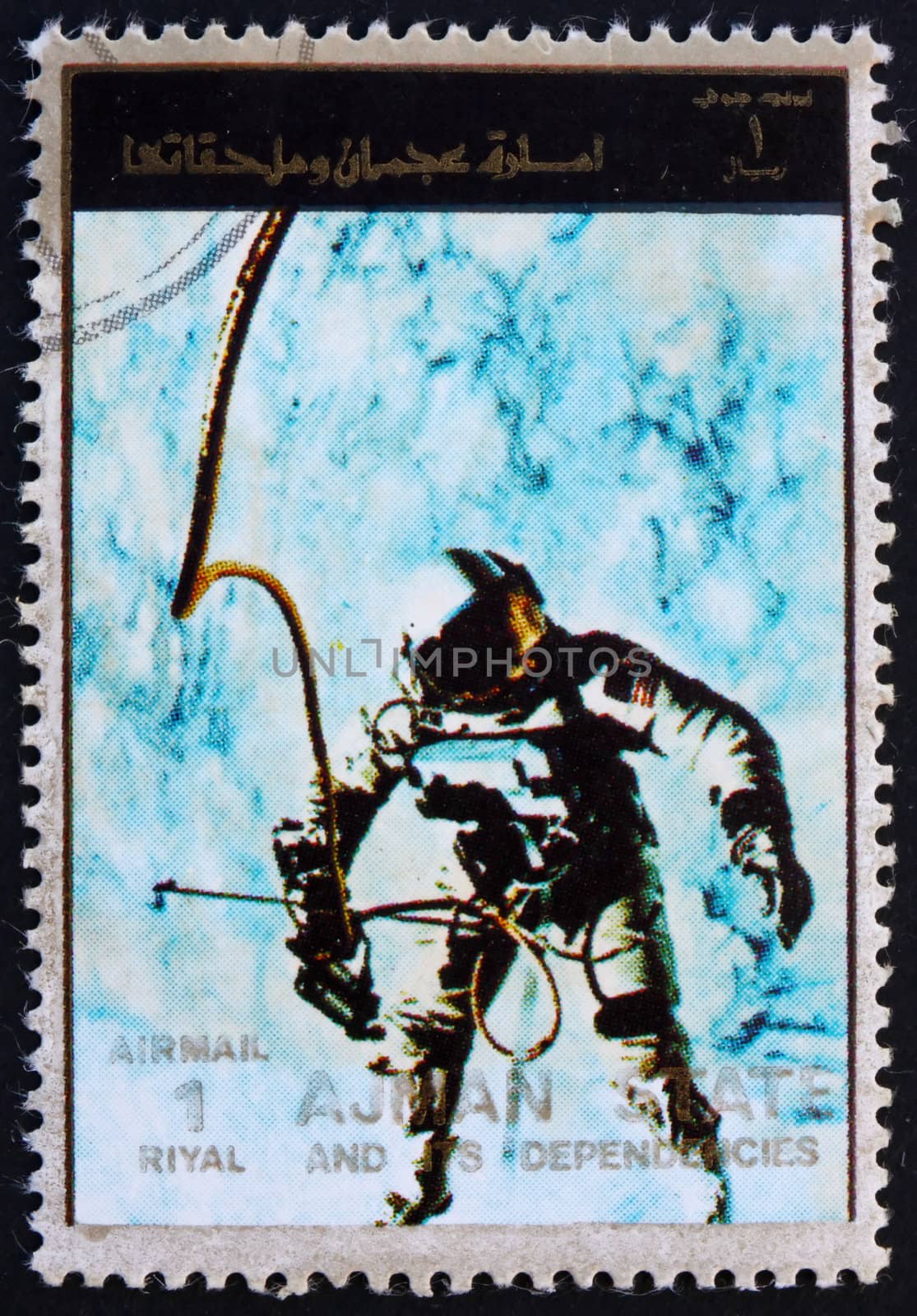 AJMAN - CIRCA 1973: a stamp printed in the Ajman shows Edward White during Spacewalk, Gemini 4, Spaceflight Program, circa 1973