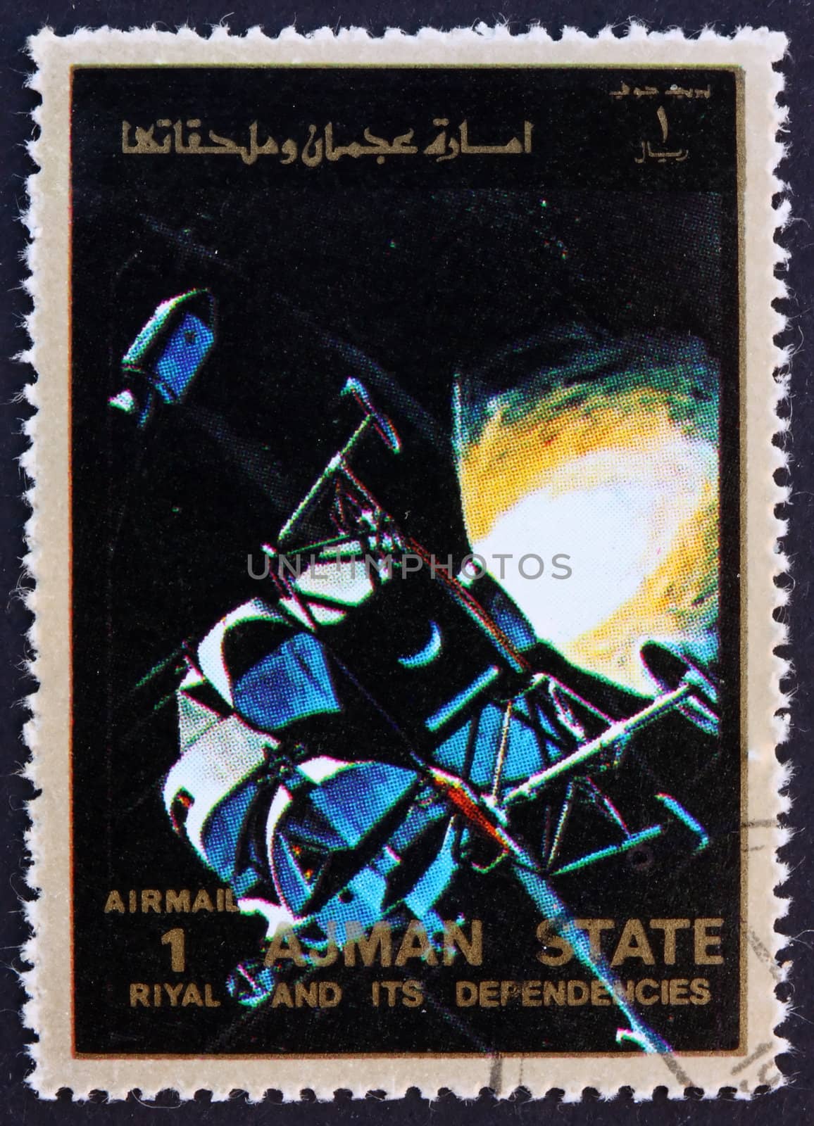 AJMAN - CIRCA 1973: a stamp printed in the Ajman shows Lunar Module and Command Module in Space, Eagle and Columbia, Moon-landing, Apollo 11, circa 1973