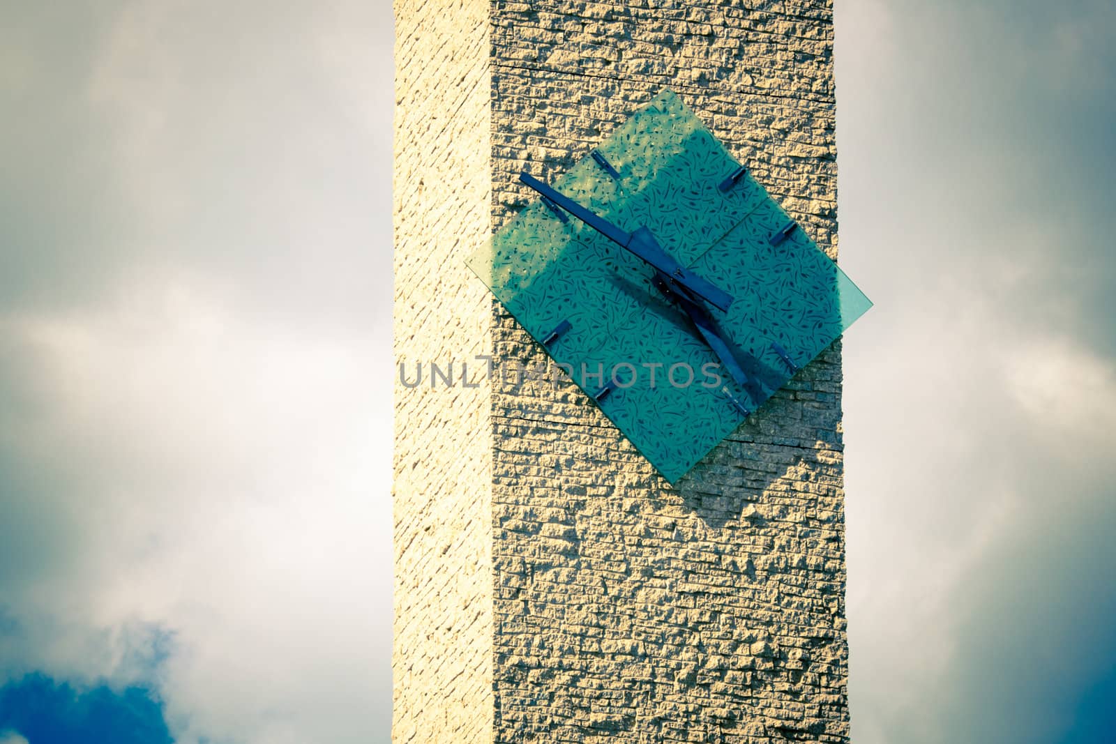 clock tower lit by sunshine and blue sky background