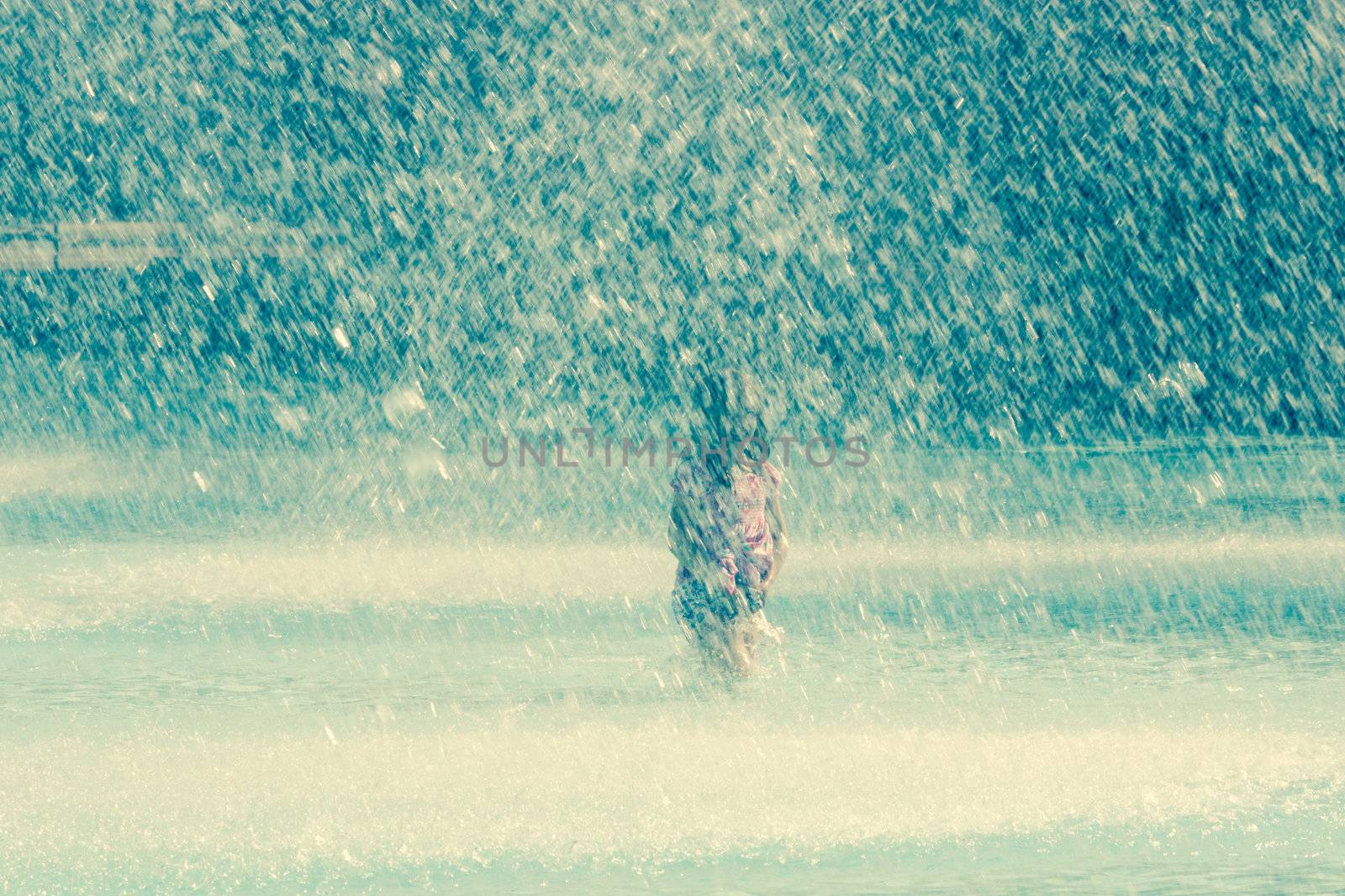 a girl in a splashing fountain by toliknik