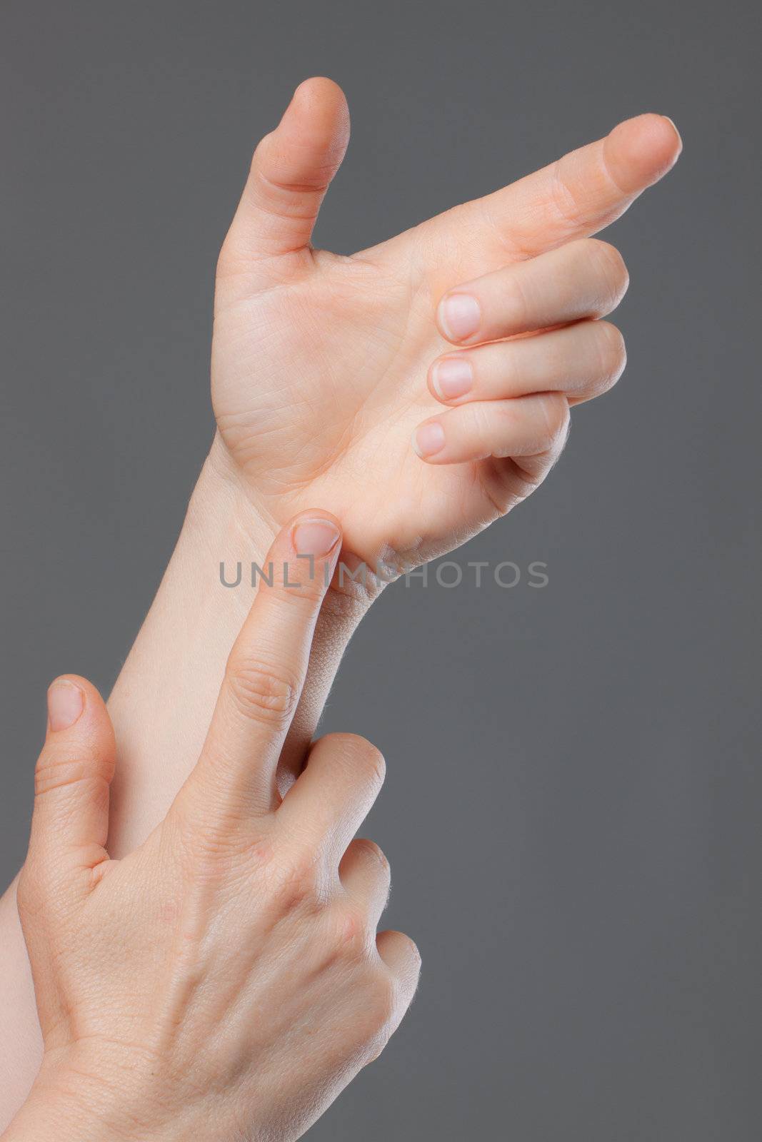 A close-up shot of hands holding and pointing at nothing. Space for text or product to be placed in hand.