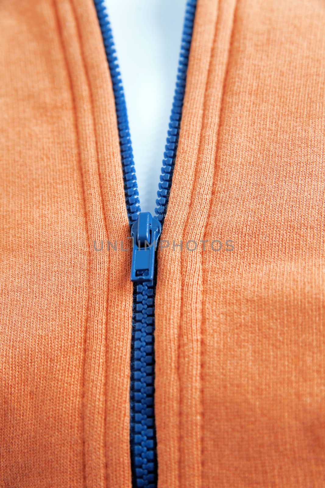 blue zipper on fashionable orange warm wear by Serp