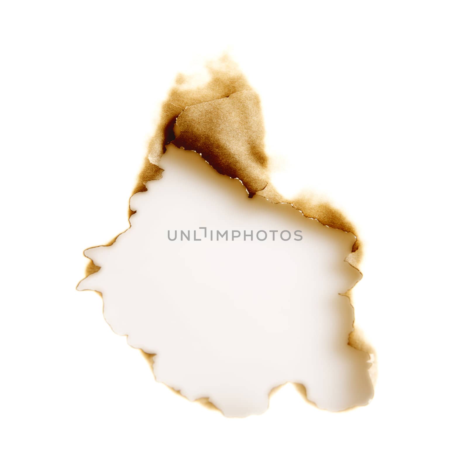 burnt hole in a white sheet of paper by Serp