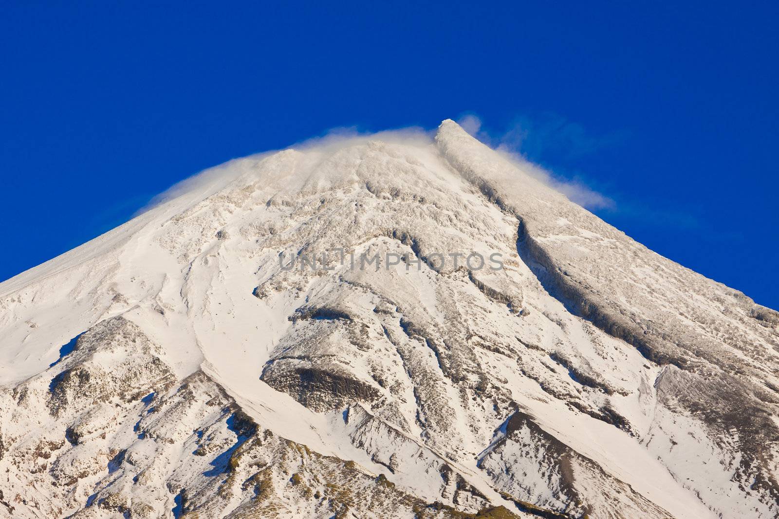 Close-up of the snowy mountain peak of Mt Taranaki or Mt Egmont, New Zealand