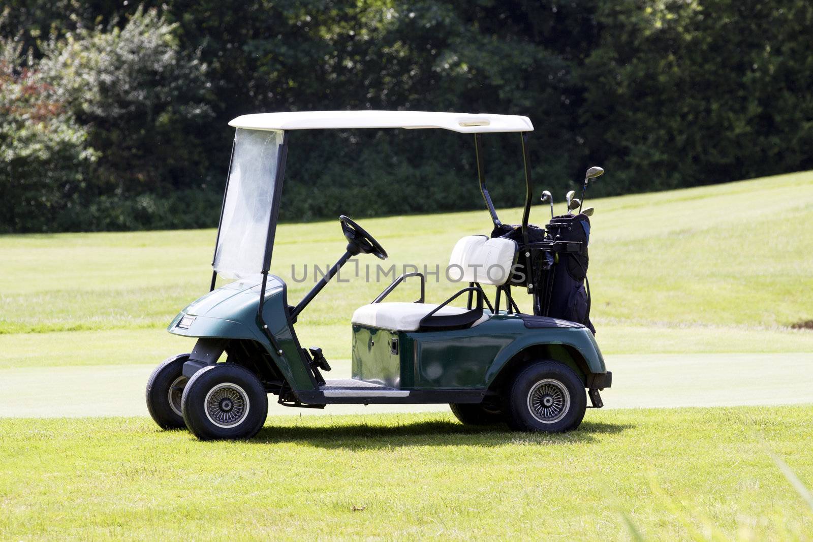 golf car on a course in summer by juniart