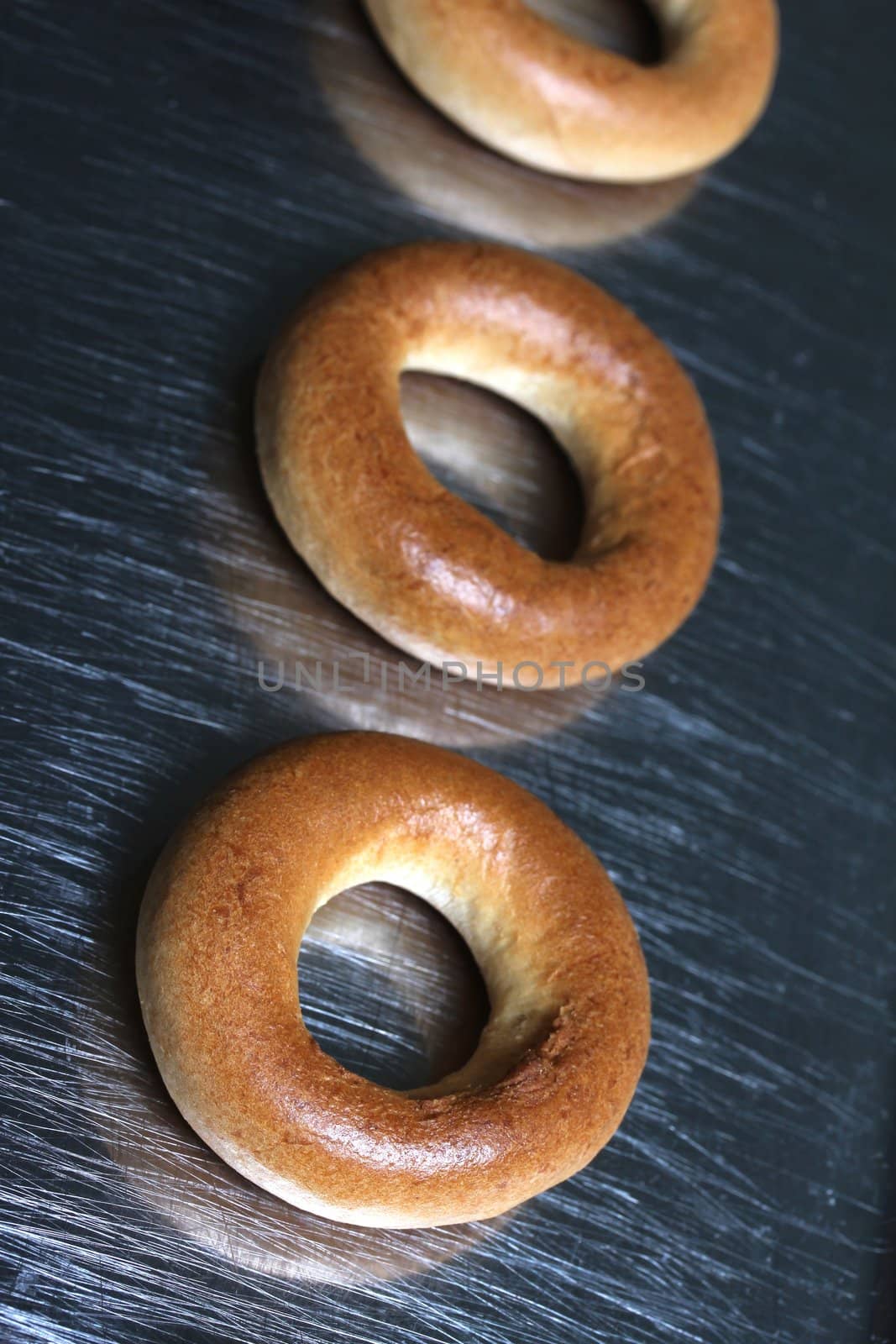 pastry rings on a steel plate by Teka77