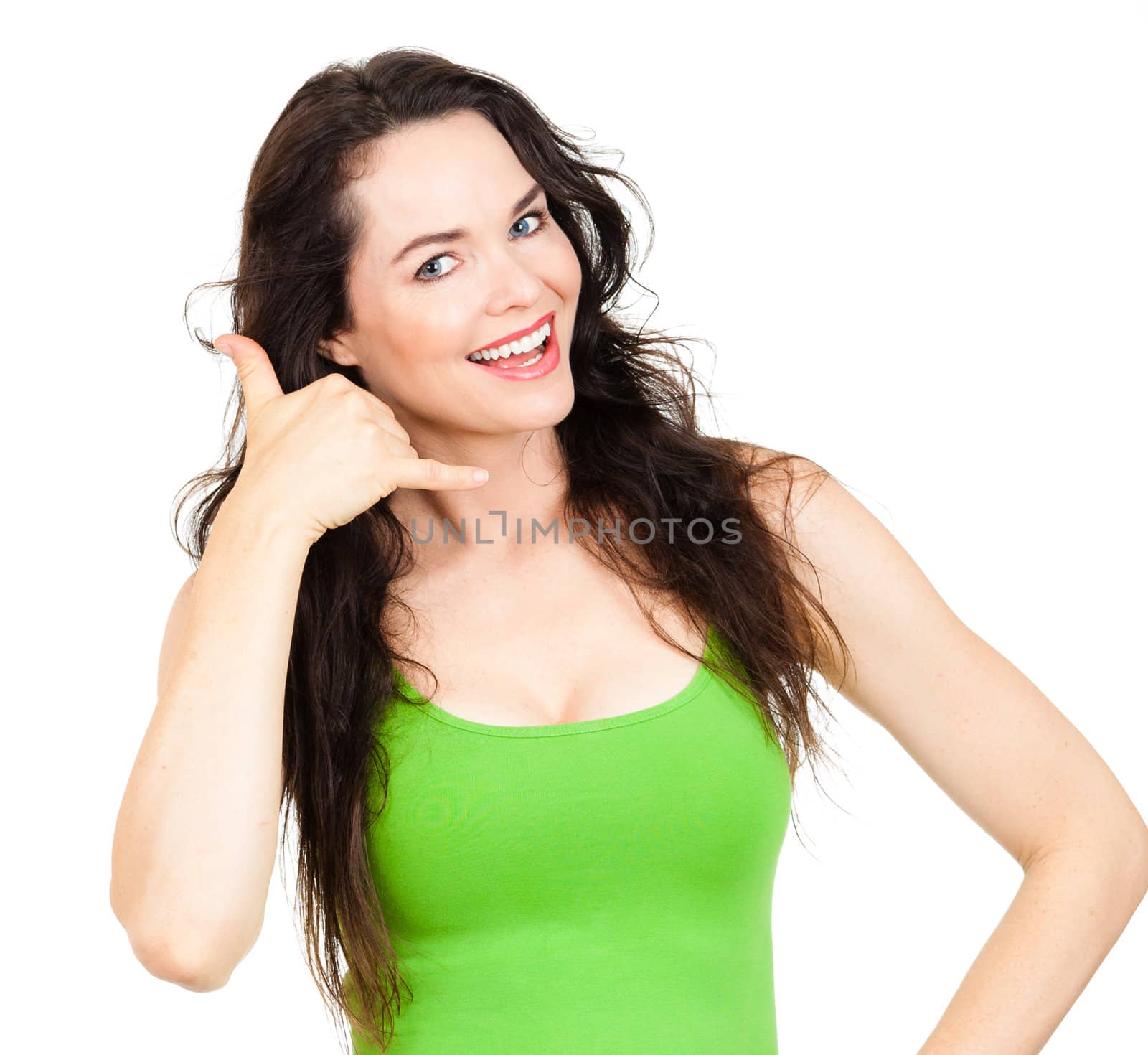 CLose-up of a  beautiful young woman smiling and making a call me sign. Isolated over white.