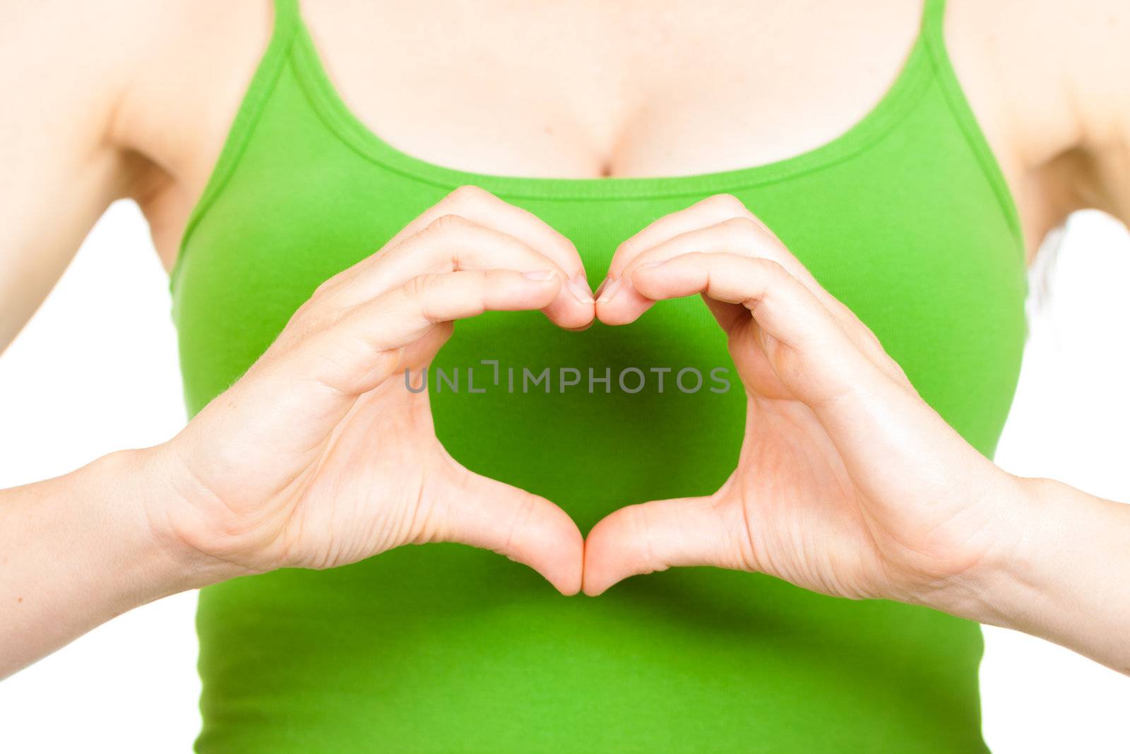 Close-up of hands making a love heart infront of a womans heart