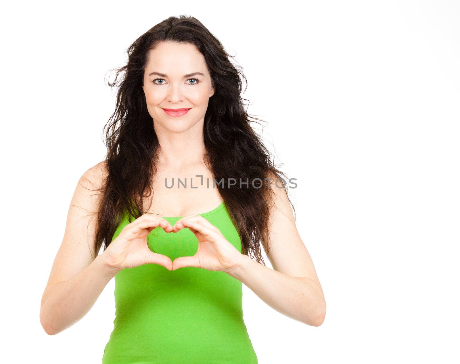 Beautiful young woman symboling a love heart with hands. Isolated over white.