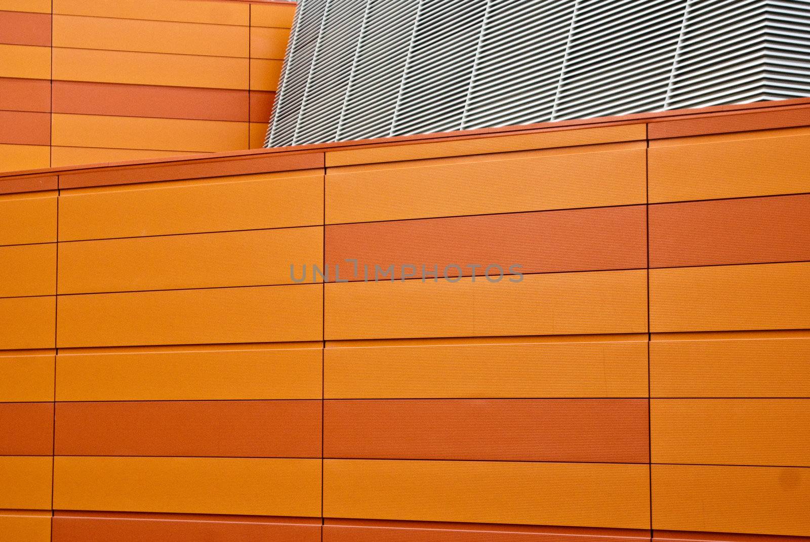 Orange block wall and metal mesh by emattil