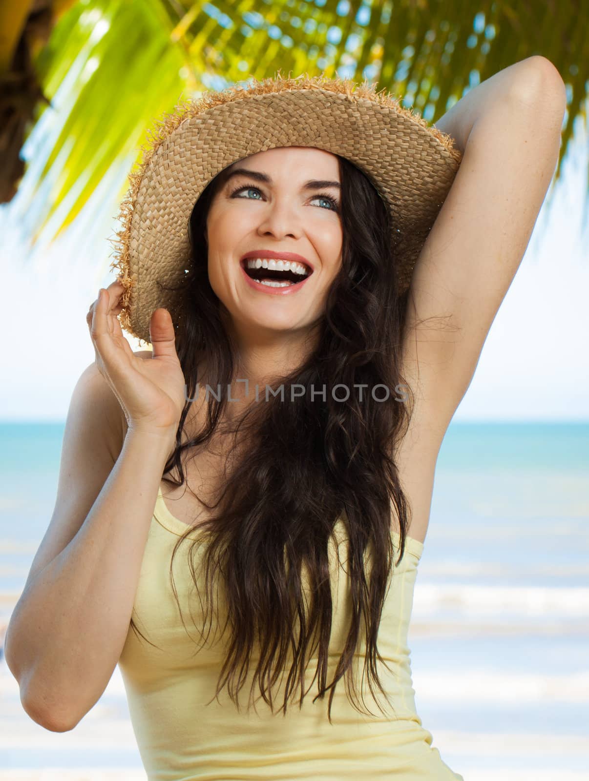 Happy young woman on tropical beach by Jaykayl