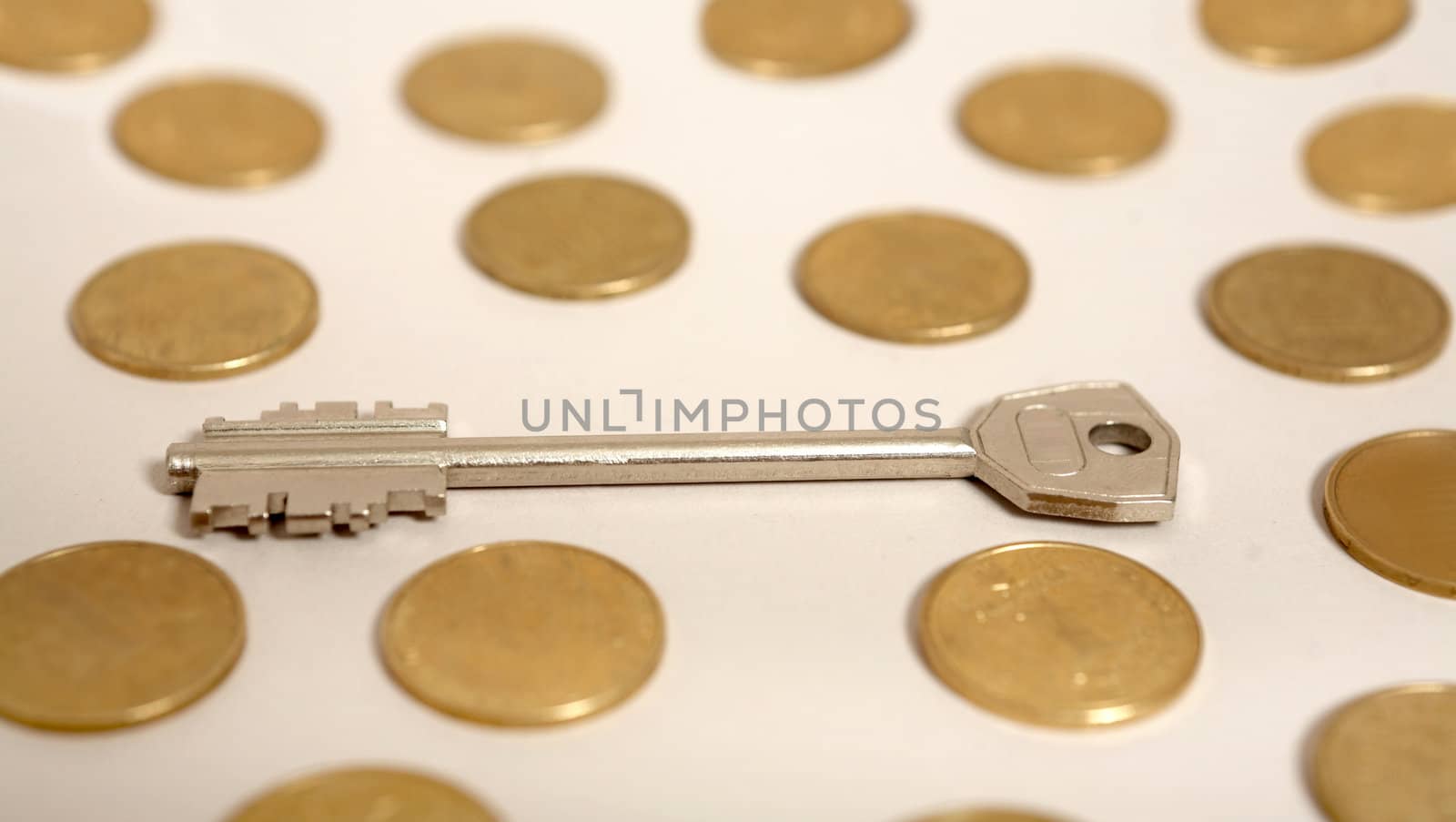 An image of gold and a key