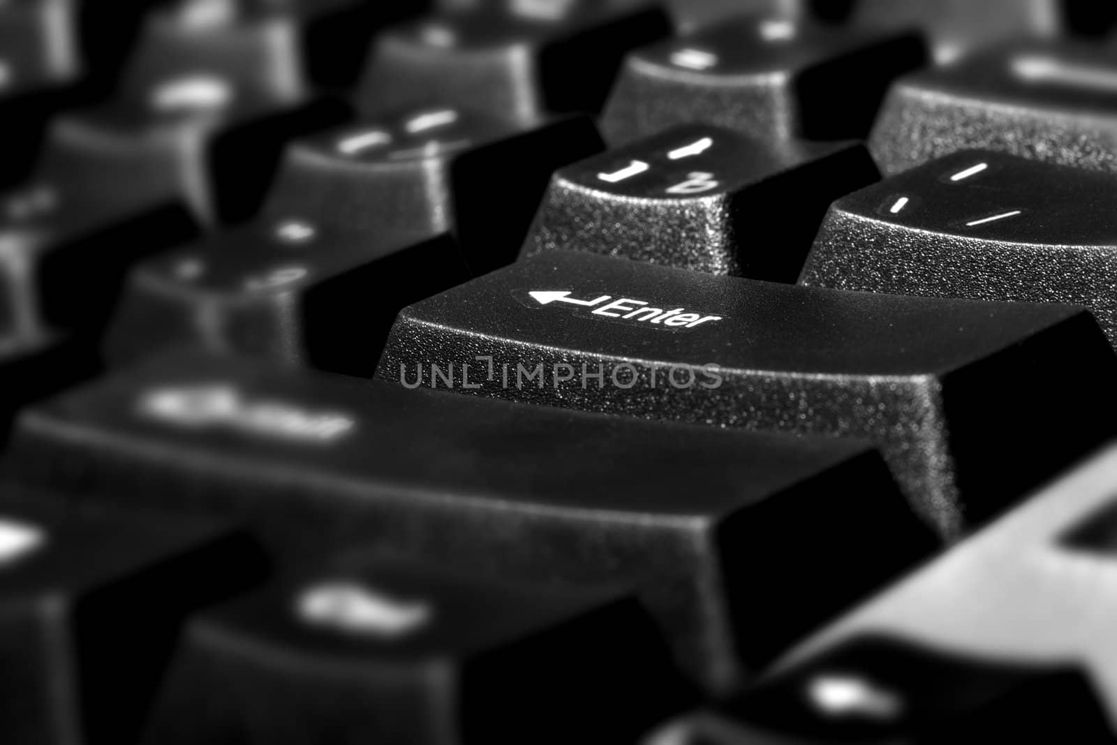Close-up photo of PC keypad with Enter button. Shallow depth of field added by macro lens