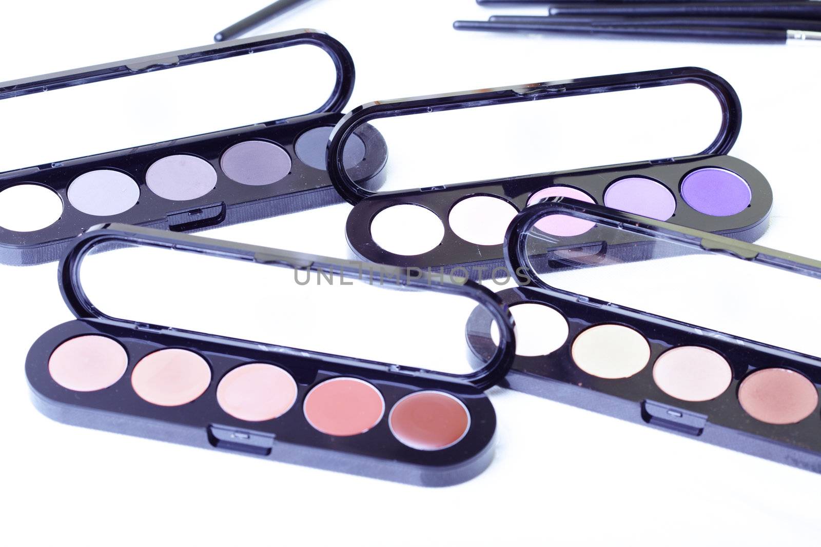 Close-up photo of the makeup set on textured white background