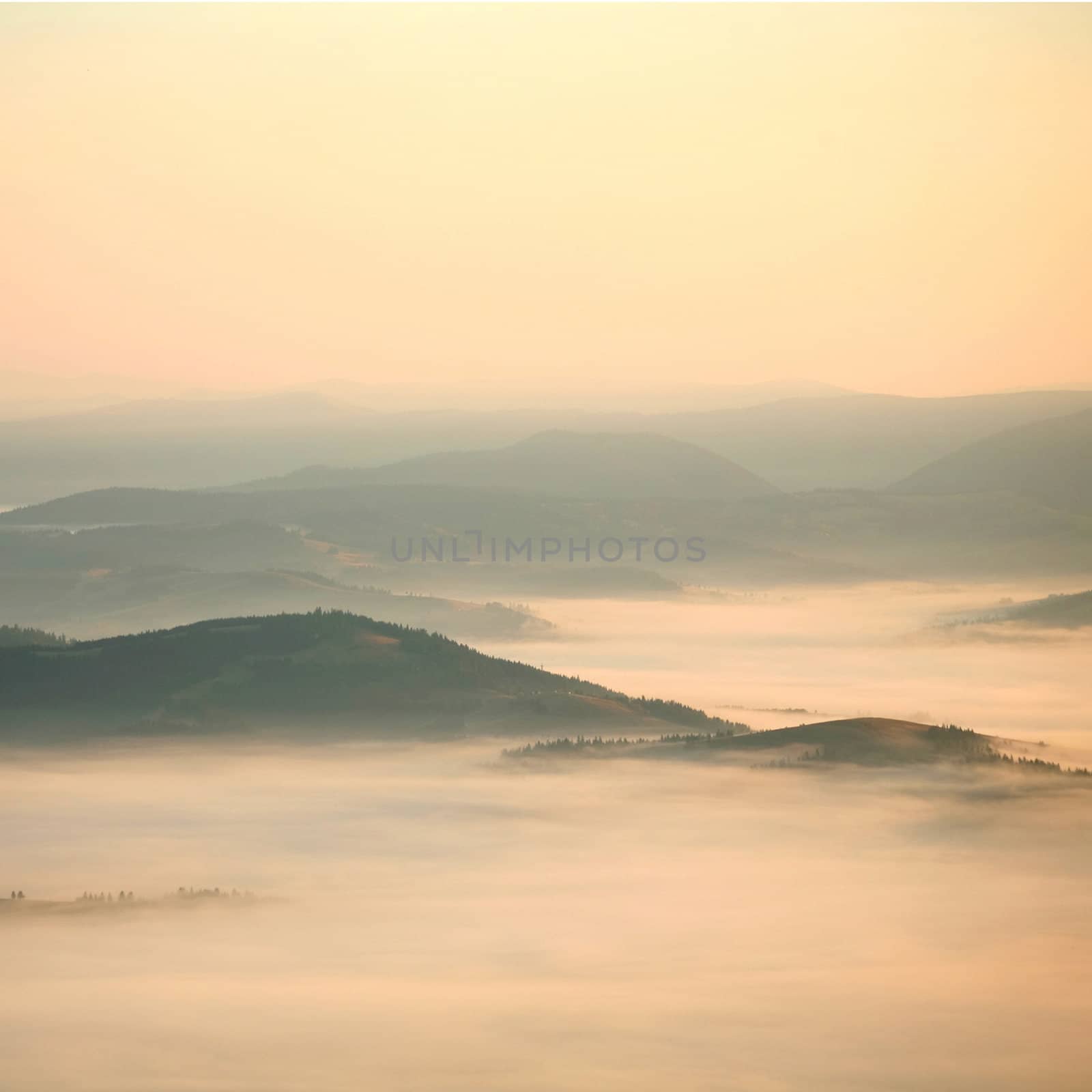 An image of yellow mist in the mountains