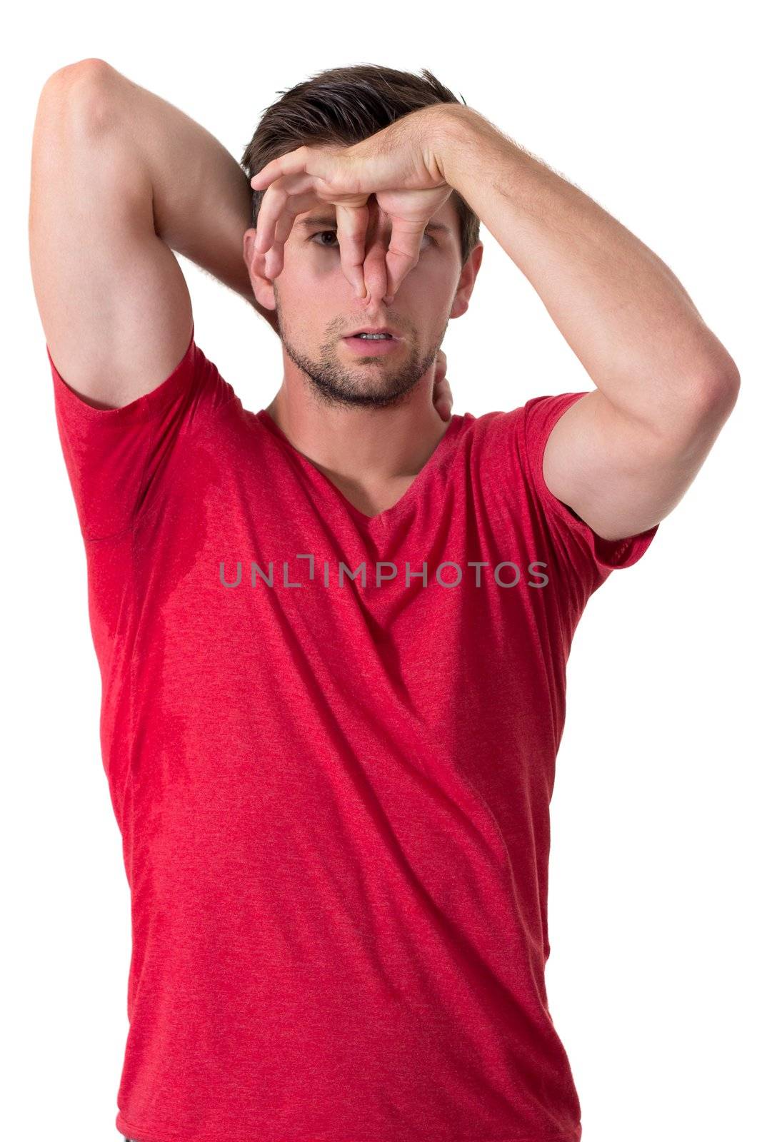 Man sweating very badly under armpit and holding nose by dwaschnig_photo
