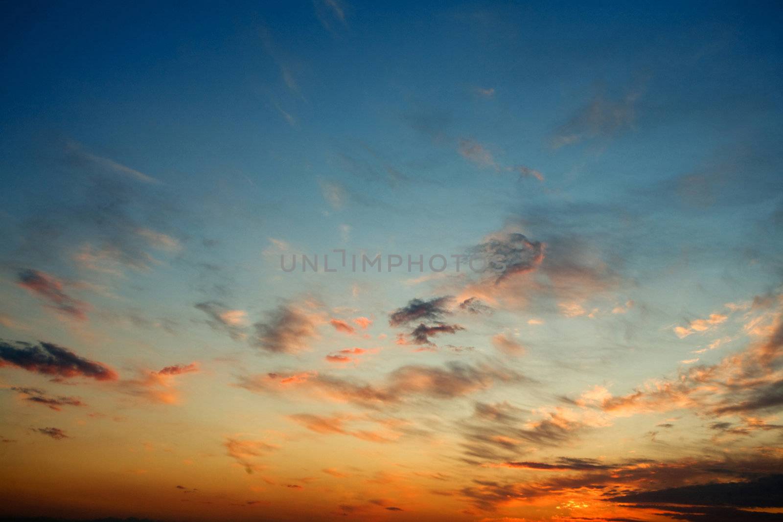 Bright glowing sunset on the dark blue sky