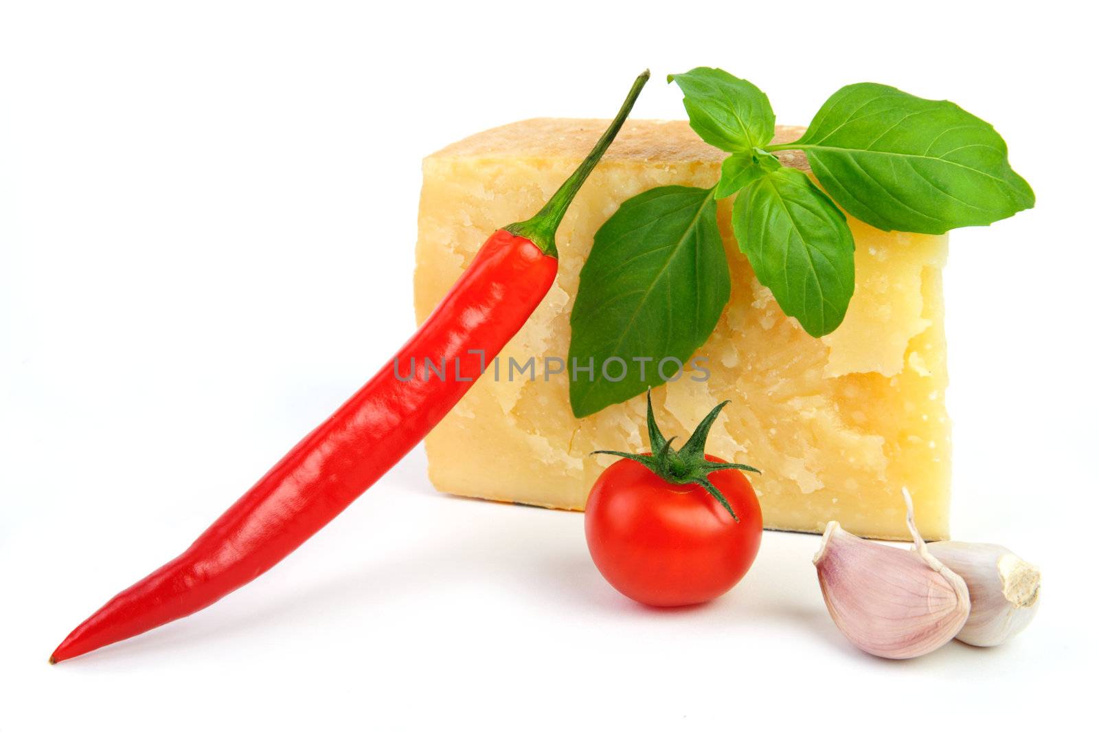 An image of cheese, tomato, pepper, garlic and basil