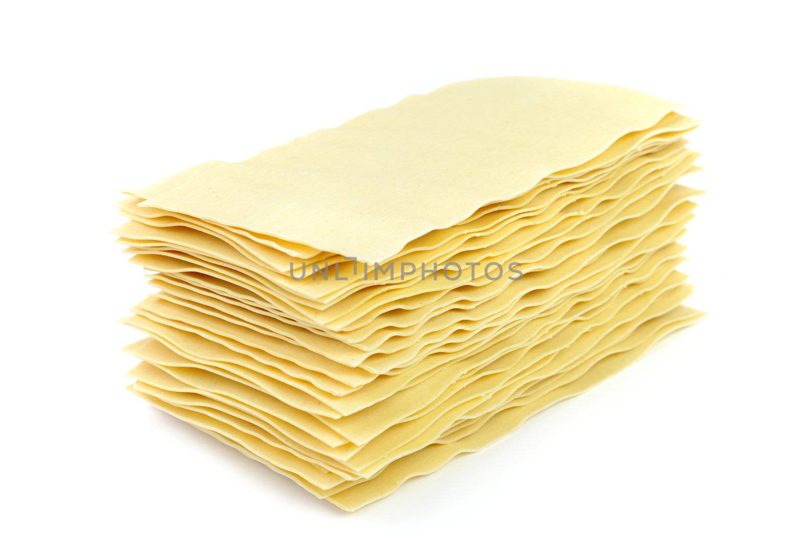 An image of raw lasagna on white background