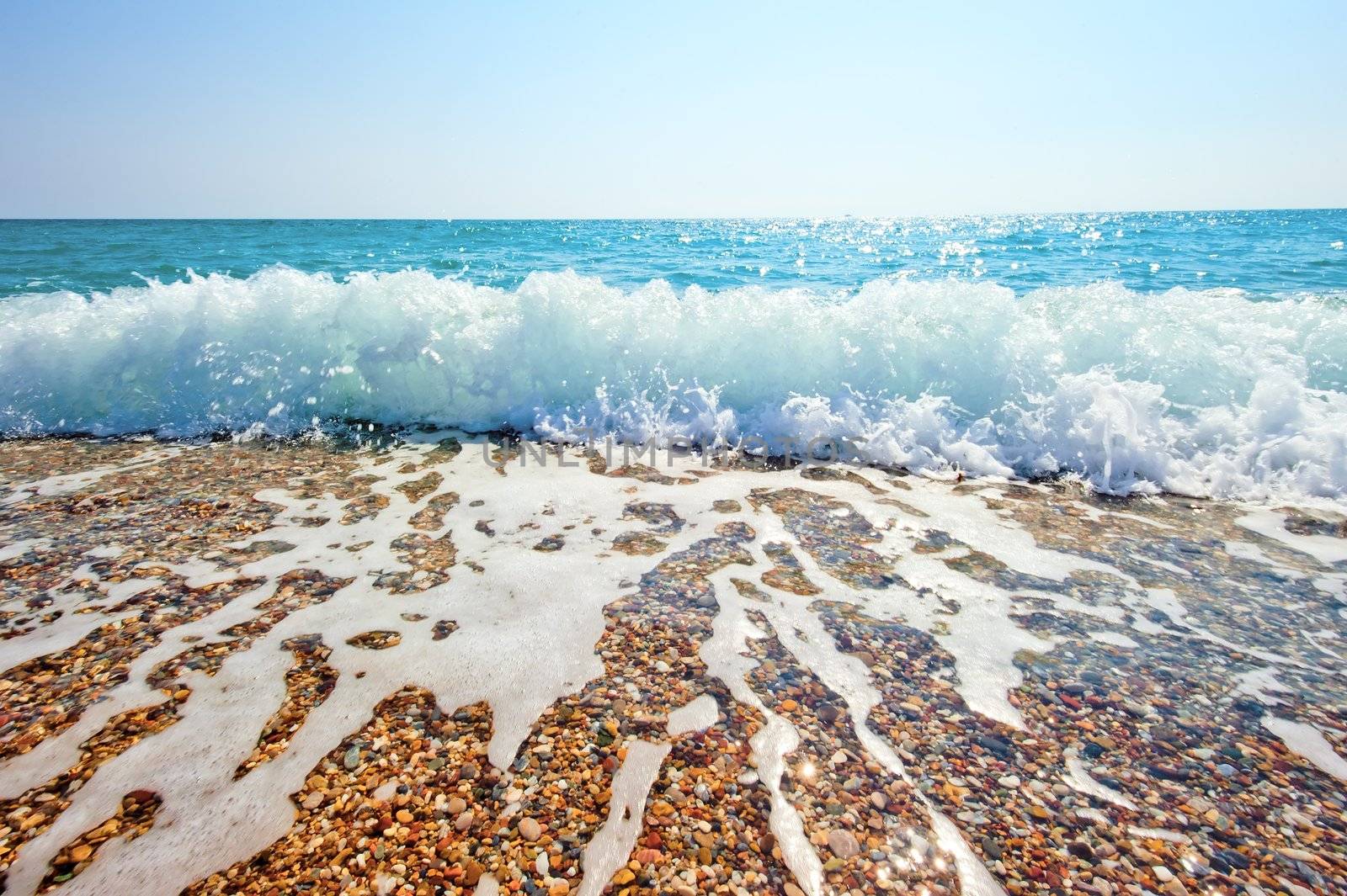 Splash of sea foam on a sandy beach by kosmsos111