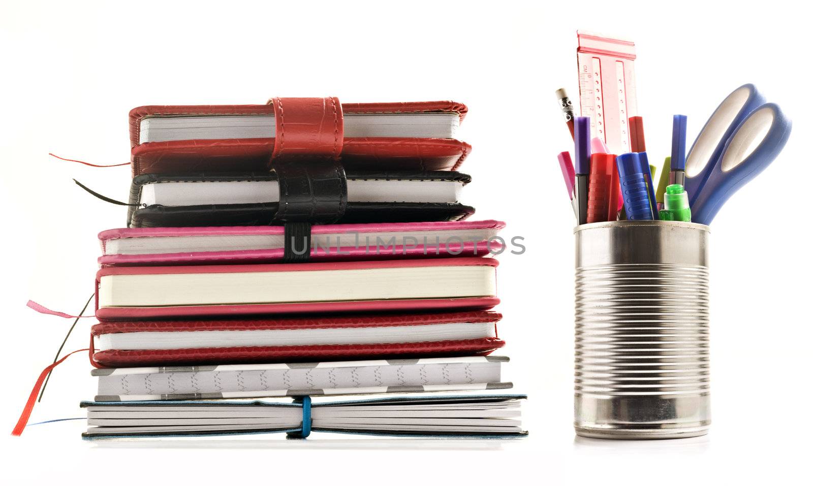 Stationery and books on white background with space for text