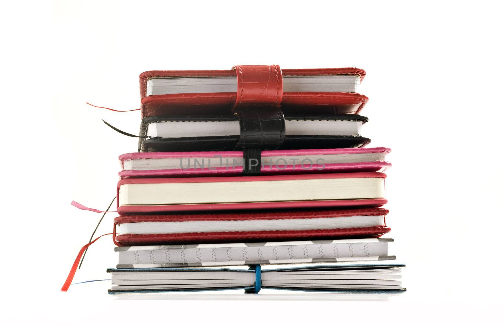 Close up of stacked up books on a white background by tish1