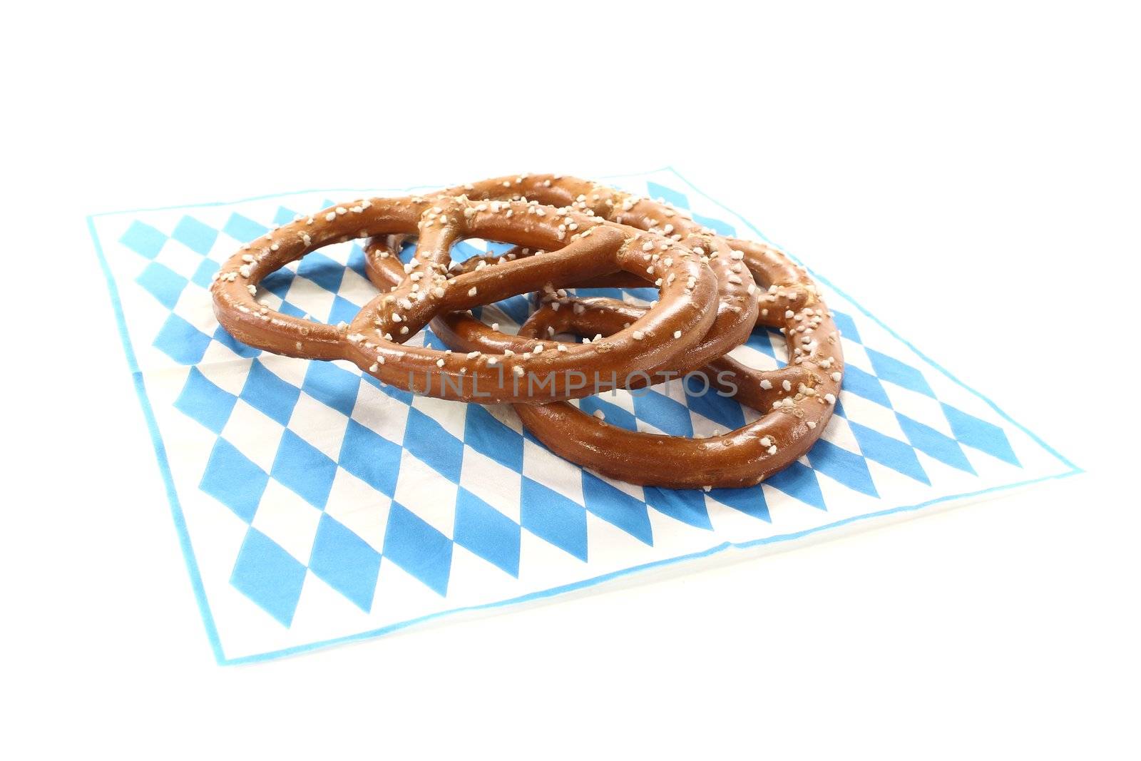 Pretzels with salt on a Bavarian napkin on a bright background