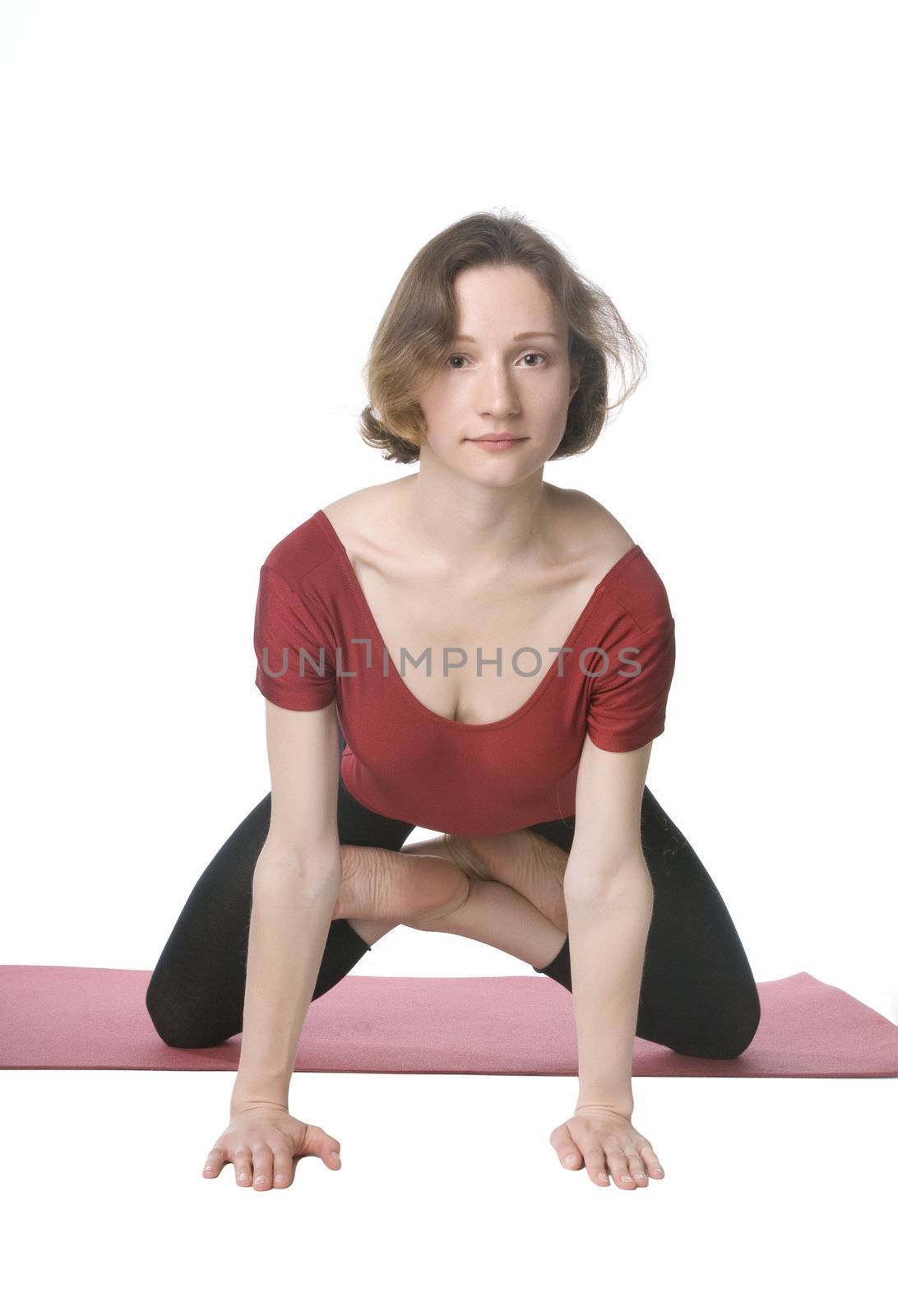 Woman exercising on a mat over white background