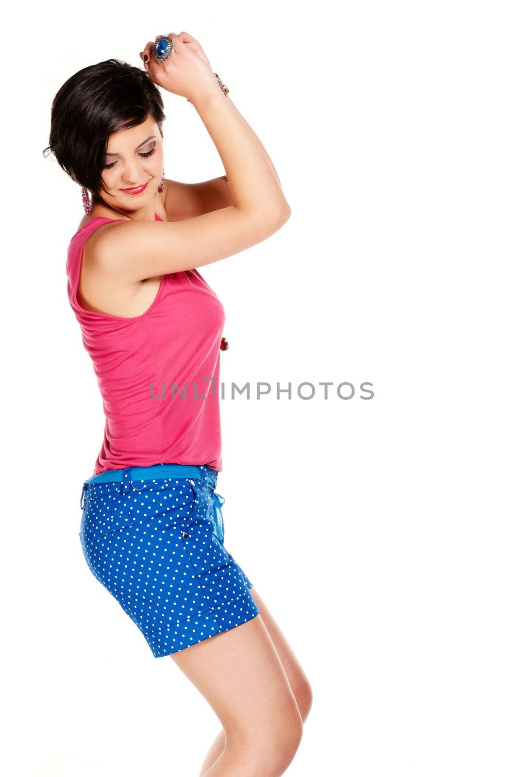 Side shot of a brunette in pink shirt isolated on white